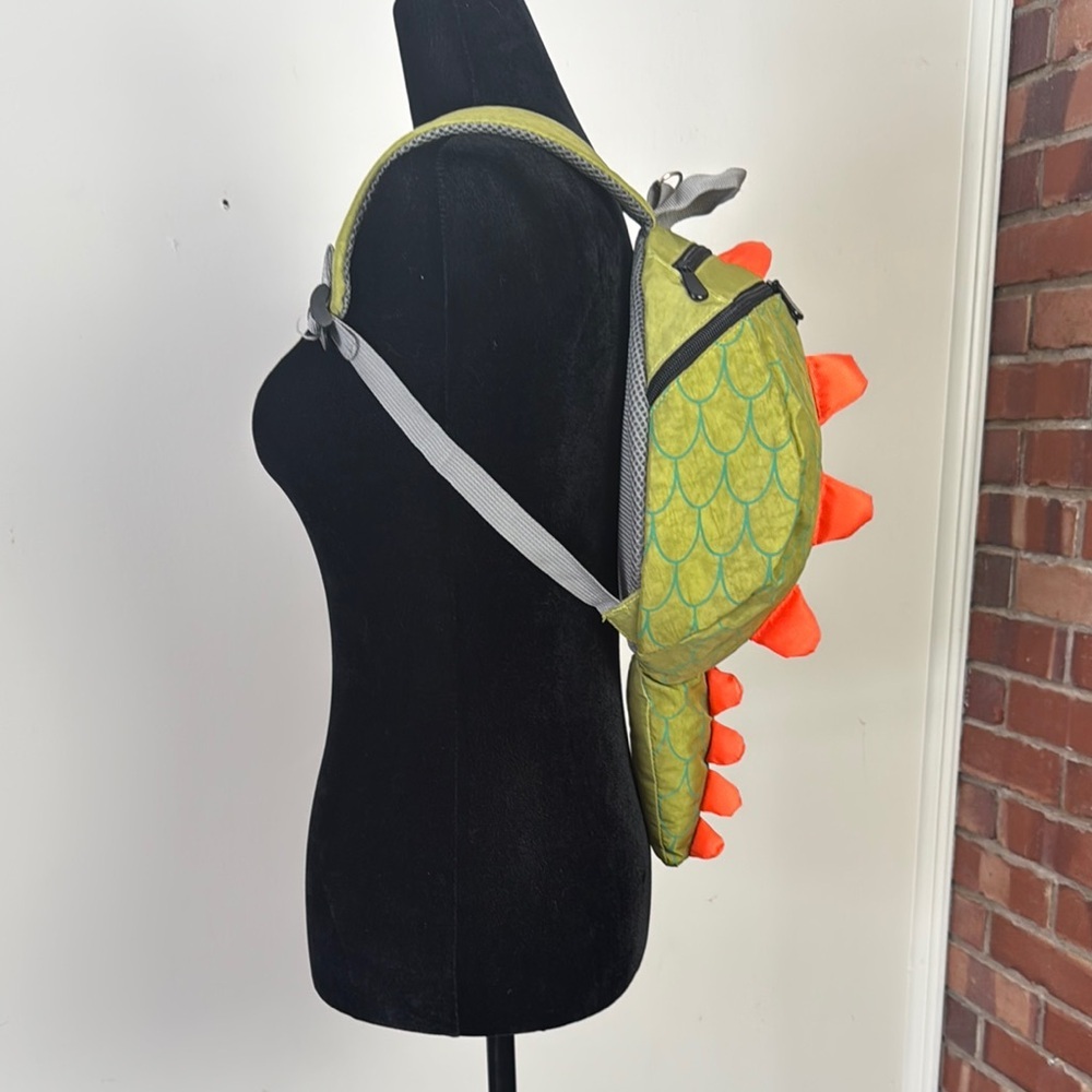 Adorable green and orange dinosaur back pack
